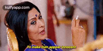 a woman is sitting in a chair smoking a cigarette and saying to make men appear innocence .