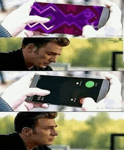 a man is holding a cell phone with a purple screen .