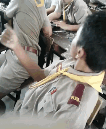 a man in a uniform with a yellow tie has a patch on his shoulder that says a.b.l.