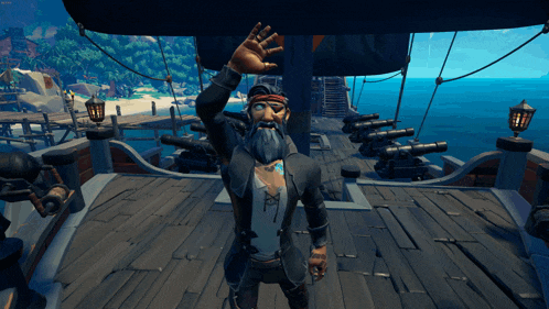 a man with a beard is standing on a ship waving