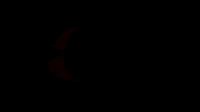 a red light is coming out of a hole in the dark