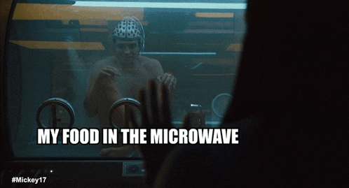 a man in a microwave with the words my food in the microwave above him