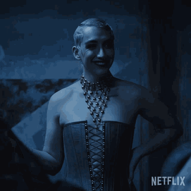 a woman wearing a corset and a necklace with a netflix logo in the corner