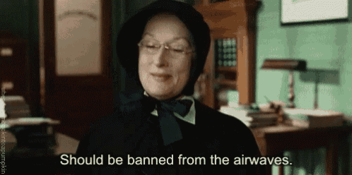 a woman in a black hat and scarf is saying should be banned from the airwaves
