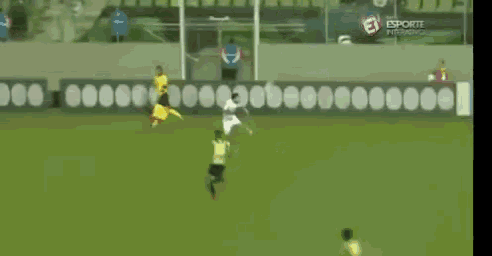 a soccer game is being played on a field with a banner that says uns on it