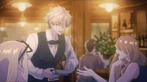 a man in a vest and bow tie is talking to a woman in a restaurant