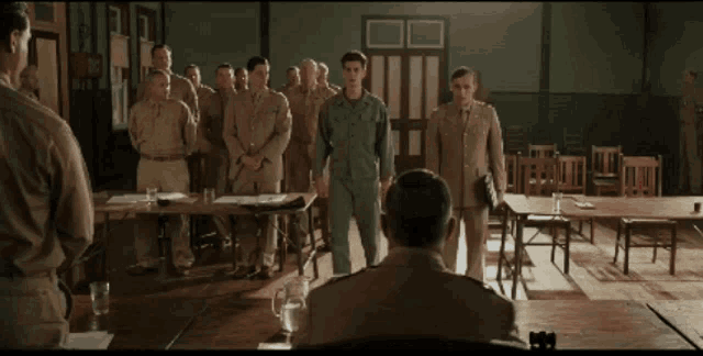 a group of soldiers standing around a table in a room