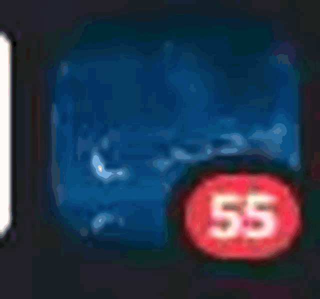 a red button with the number 63 on it on a blue background .