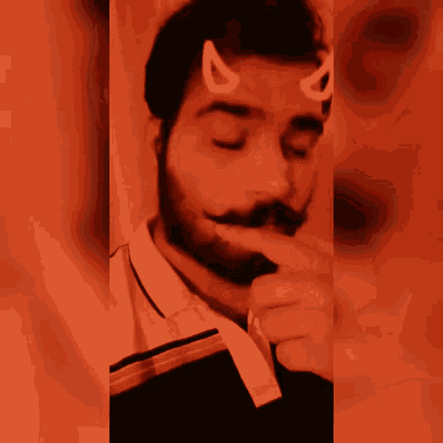 a man with a devil horn on his head