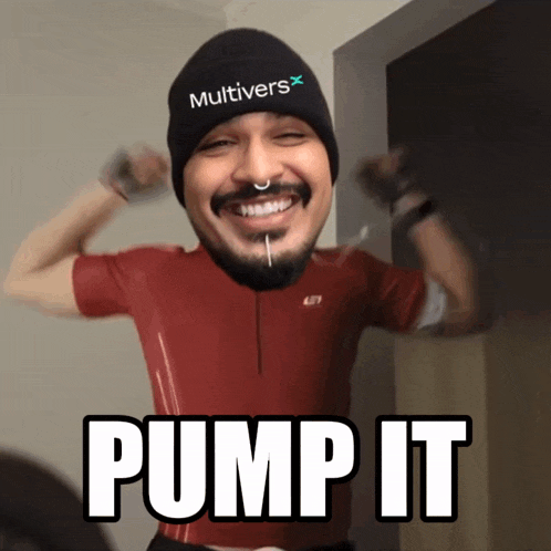 a man wearing a beanie that says multivers on it pumps his muscles