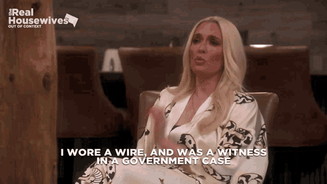 a woman sitting in a chair with the words i wore a wire and was a witness in a government case on the bottom