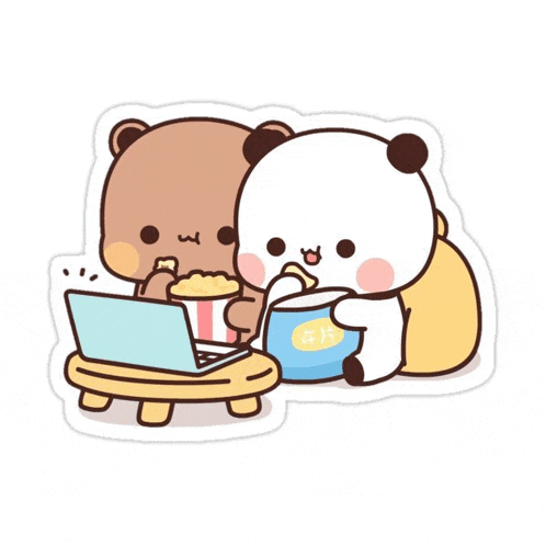 two panda bears are sitting at a table eating popcorn and watching a movie .