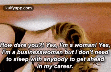 a woman is laying on a bed with a quote about being a business woman .