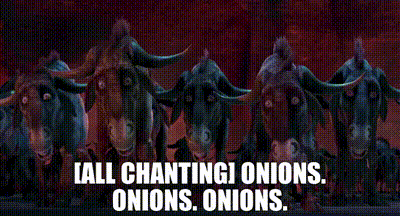 a statue of a bull with the words all chanting onions onions onions written below it .