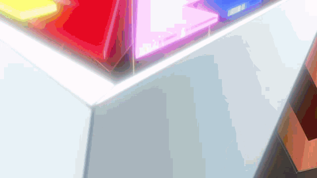 a close up of a white box with a rainbow of colors