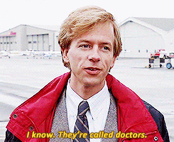a man in a suit and tie is talking about doctors