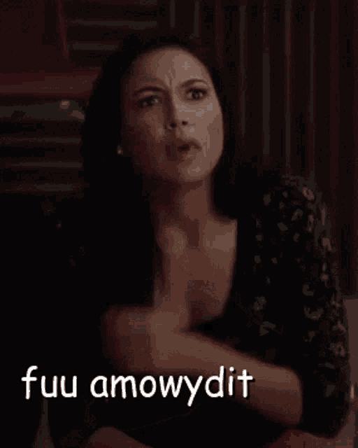 a woman is holding her chest with a caption that says " fuu amowydit " on it