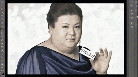 a woman in a blue dress is waving her hand in front of a computer screen with chinese writing on it .