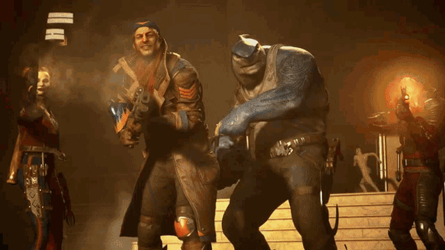a man with a gun is standing next to a man with a welding mask on