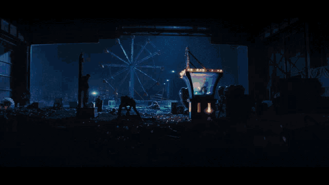 a ferris wheel is lit up at night in a dark carnival