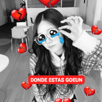 a black and white photo of a woman with a red sticker that says donde estas goeun