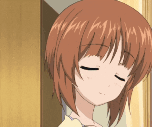 a close up of a girl 's face with closed eyes