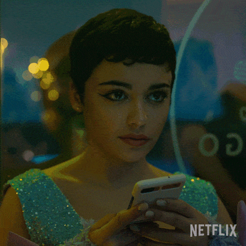 a woman is looking at herself in a mirror with netflix written on the bottom right