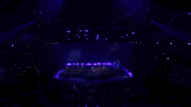 a group of people playing instruments on a stage