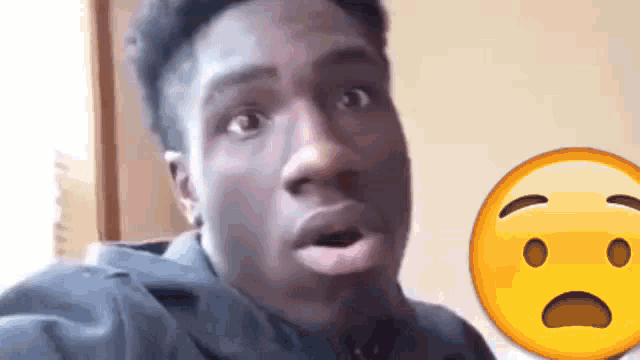 a man with a surprised look on his face next to a sad smiley face