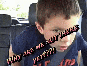 a young boy is sitting in the back seat of a car with why are we not there yet written on his face