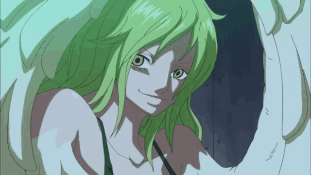 a woman with green hair and white wings looks at the camera