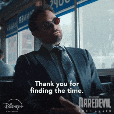 a man in a suit and tie says thank you for finding the time on a daredevil born again poster