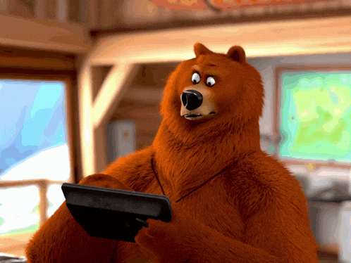 a cartoon bear is holding a tablet computer