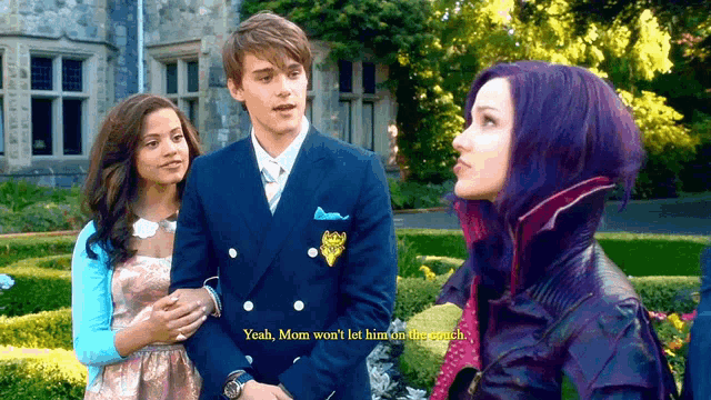 a girl with purple hair is standing next to a man in a suit