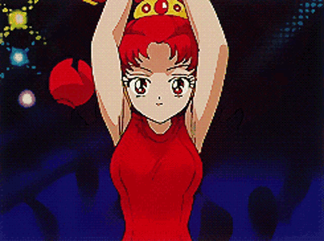 a girl in a red dress is holding a crown