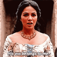 a woman in a white dress is saying his ass belongs to me