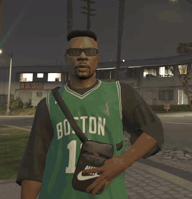 a man wearing a green boston jersey is holding a black nike bag