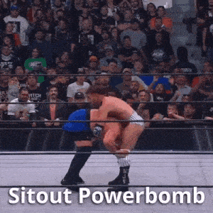 a wrestling match is taking place in front of a crowd and the words sitout powerbomb are on the screen .