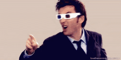 a man in a suit and tie wearing 3d glasses