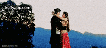 a picture of a man and a woman hugging with the words kulfyapp.com at the top