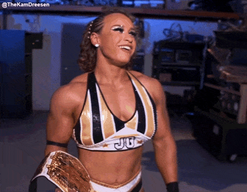 a female wrestler is wearing a top that says ju