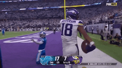a football player with the number 18 on their back