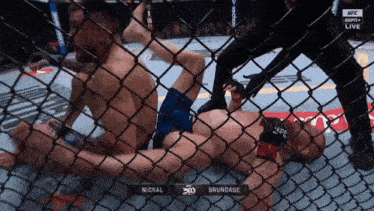 a man is laying on the ground in a cage with the words brundage on the bottom