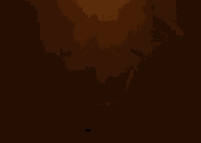 a gold star is surrounded by sparkles on a black background