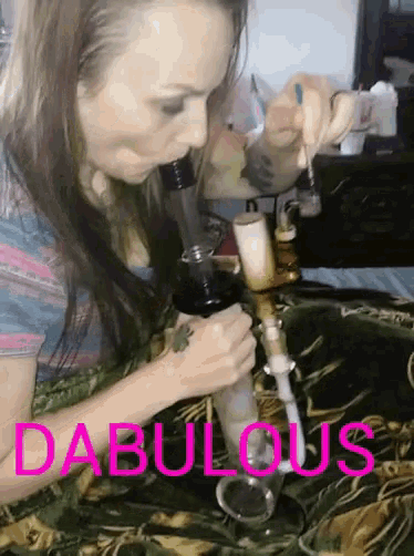 a woman is smoking a bong and the word dabulous is on the bottom of the image