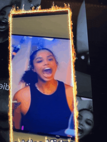 a picture of a woman is surrounded by flames on a screen