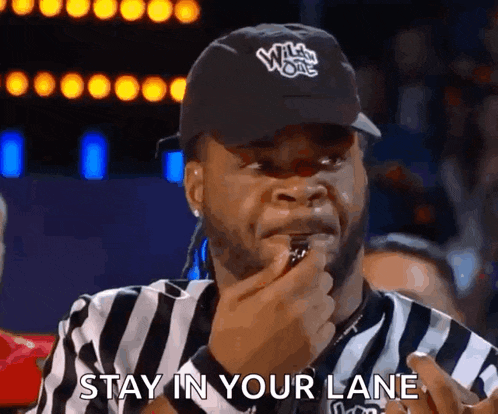 a referee wearing a hat that says wild ones on it