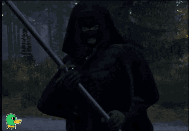 a person in a black hooded cape is holding a spear in a dark forest