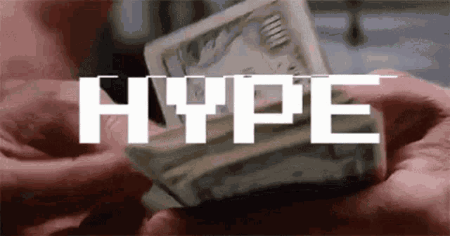 a person is holding a stack of money in their hands with the word hype written above it .