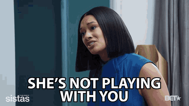a woman says she 's not playing with you while wearing a blue shirt